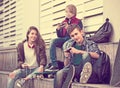 Three teenagers with smartphones in outdoors Royalty Free Stock Photo