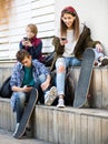 Three teenagers with smartphones in outdoors Royalty Free Stock Photo