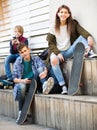 Three teenagers with smartphones Royalty Free Stock Photo
