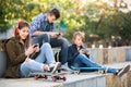 Three teenagers with smartphones Royalty Free Stock Photo