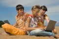 Three teens with laptops