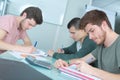 Three teens studying together