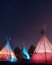 Teepees glowing under a starry sky at night in Marfa, Texas Royalty Free Stock Photo