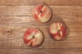 Three tender ripe peaches on a wooden table. Copy space Royalty Free Stock Photo