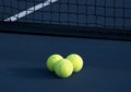 Three Tennis Balls on a Tennis Court Royalty Free Stock Photo