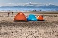 Three tents situated on a beach, on a sunny day Royalty Free Stock Photo