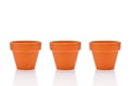 Three terracotta flower pots isolated on white Royalty Free Stock Photo