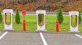 three Tesla Supercharger charging station for Tesla electric vehicles in Fall