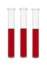 Three test-tubes with red liquid