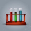 Three test tubes in wooden box Royalty Free Stock Photo