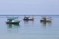 Three Thai fishing boats in the sea. Island Koh Phangan, Thailand Royalty Free Stock Photo