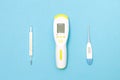 three thermometers , electronic, mercury and infrared thermometers for measuring body temperature