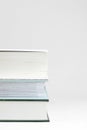 Three thick books on a table Royalty Free Stock Photo