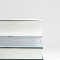 three thick books on a table