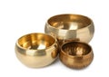 Three Tibetan singing bowls on white background