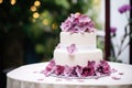 a three-tier fondant wedding cake with flower decorations Royalty Free Stock Photo