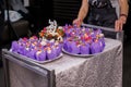 Three tier white wedding cake with decor and flowers