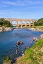 Three-tiered aqueduct Pont du Gard - the highest in Europe. Provence, spring sunny day. The bridge was built in Roman times on Royalty Free Stock Photo