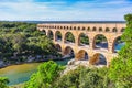 Three-tiered aqueduct Pont du Gard and natural park Royalty Free Stock Photo