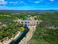 Three-tiered aqueduct Pont du Gard was built in Roman times on the river Gardon and magnificent natural park, Provence