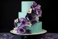 three-tiered cake with fondant and sugar flowers