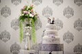 Three tiered music themed wedding cake with musical notes and bride and groom figurine topper Royalty Free Stock Photo