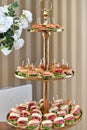 Three-tiered tray of assorted mini sandwiches with ham and lettuce Royalty Free Stock Photo