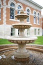 Three Tiered Water Fountain with Wishing Pond in Front of Historic old Building Royalty Free Stock Photo