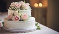 A three tiered wedding cake with pink and white flowers