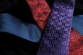 Three ties crossing on top of the other on black velvet Royalty Free Stock Photo