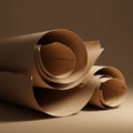Three tightly rolled sheets of brown paper rest on a matching surface. Each roll has Royalty Free Stock Photo