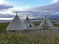 Three tipis close to norwegian shoreline