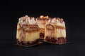 Three tiramisu pieces isolated on black background. Royalty Free Stock Photo