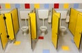 Three toilets of a bathroom nursery with yellow doors