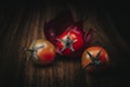 Three Tomatoes cherry on a table Royalty Free Stock Photo