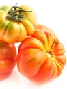 Three tomatoes in a cut out view Royalty Free Stock Photo