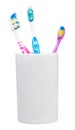 Three tooth brushes in ceramic glass Royalty Free Stock Photo