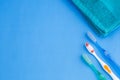 Three toothbrushes - blue towel