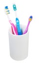 Three toothbrushes in ceramic glass Royalty Free Stock Photo