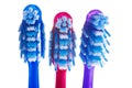 Three toothbrushes on a white background Royalty Free Stock Photo