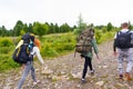 Three tourists with backpacks