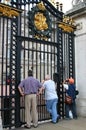 Tourists at the main Buckingham Palace gate in London, UK. Royalty Free Stock Photo