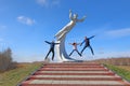 Three tourists near the monument to the Soviet woman-cosmonaut Valentina Tereshkova in the Altai in Russia