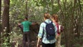 Three tourists in the woods