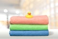 Three towels and rubber duck on the bathroom Royalty Free Stock Photo