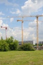 Three tower cranes on construction site Royalty Free Stock Photo