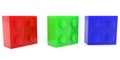 Three toy bricks of different colors next to each other Royalty Free Stock Photo