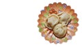 Three traditional Russian pelmeni on a decorated saucer