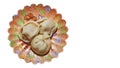 Three traditional Russian pelmeni on a saucer decorated on a white background and right copy space