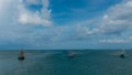 Three traditional Thai fishing boats with outriggers out